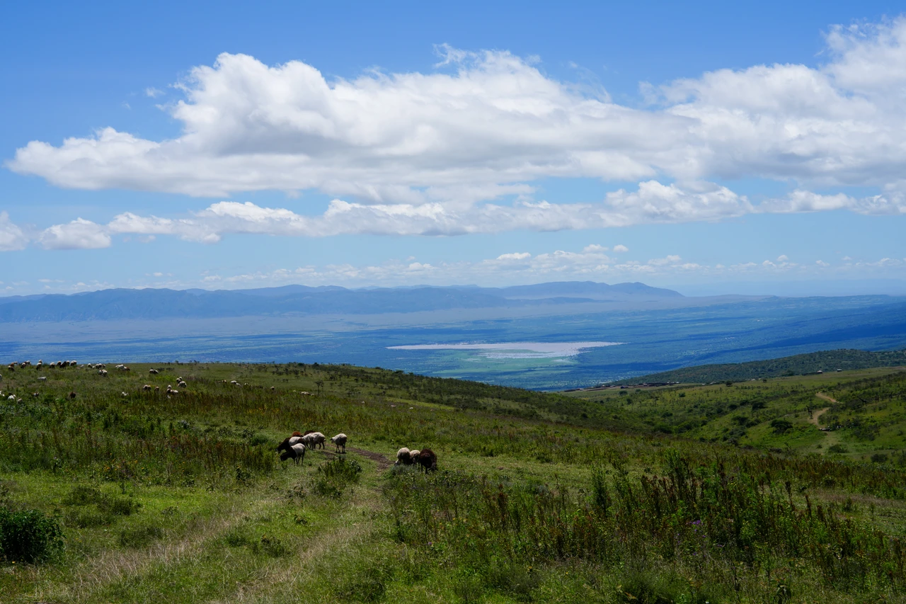 An elevated view across a lake and an expansive valley